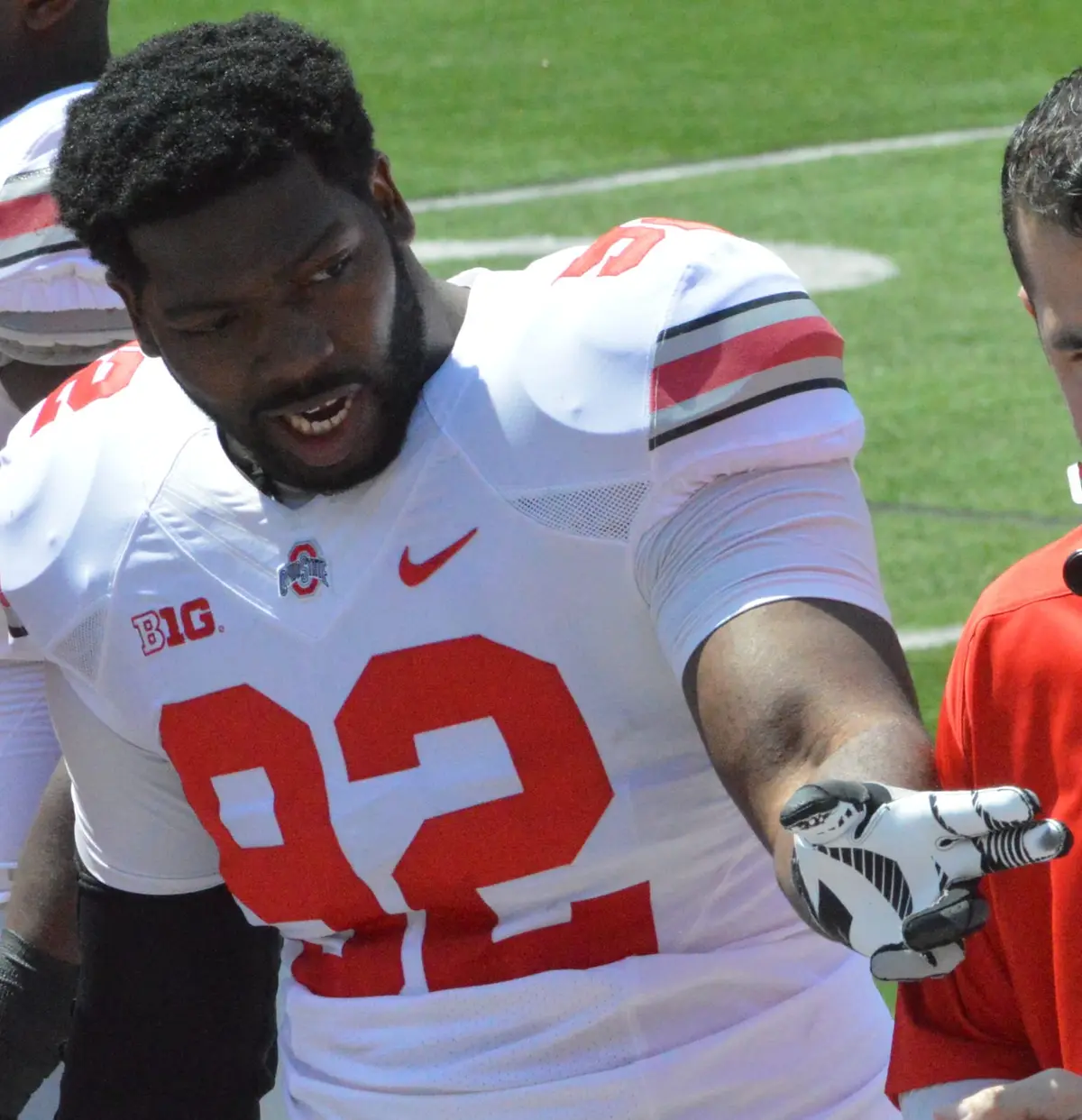 Ohio State defensive lineman Adolphus Washington in a white number 92 jersey on the sideline