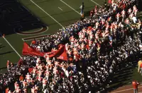 Ohio State players running onto the field at Ohio Stadium