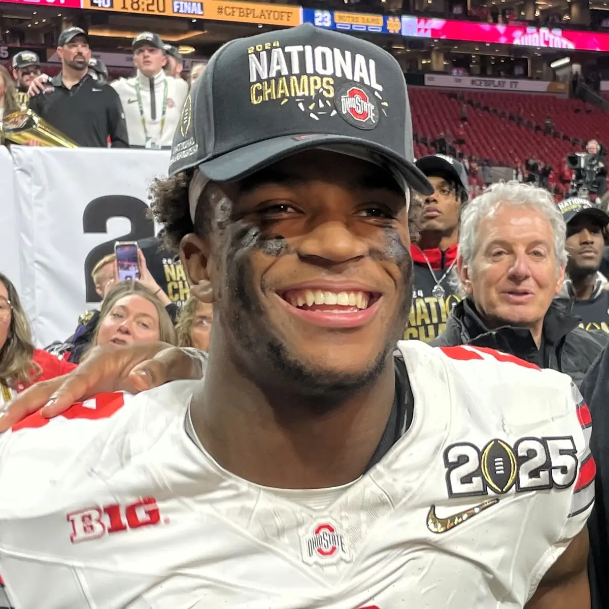 Caleb Downs in Ohio State uniform and a national champions cap after the 2025 CFP title game