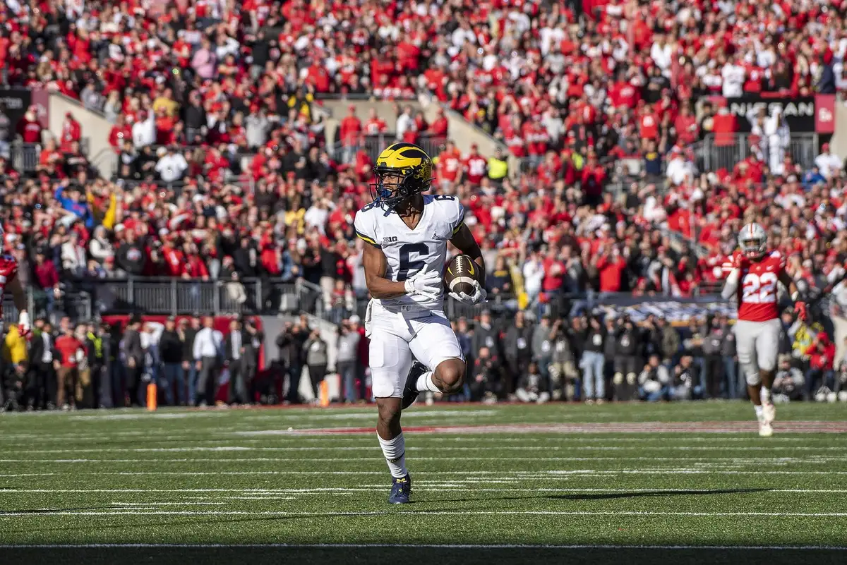 Ohio State and Michigan players on the field during the 2022 rivalry game