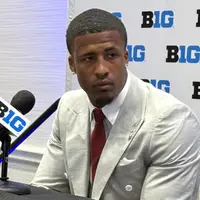 Sonny Styles in a suit at a podium during Big Ten Football Media Days