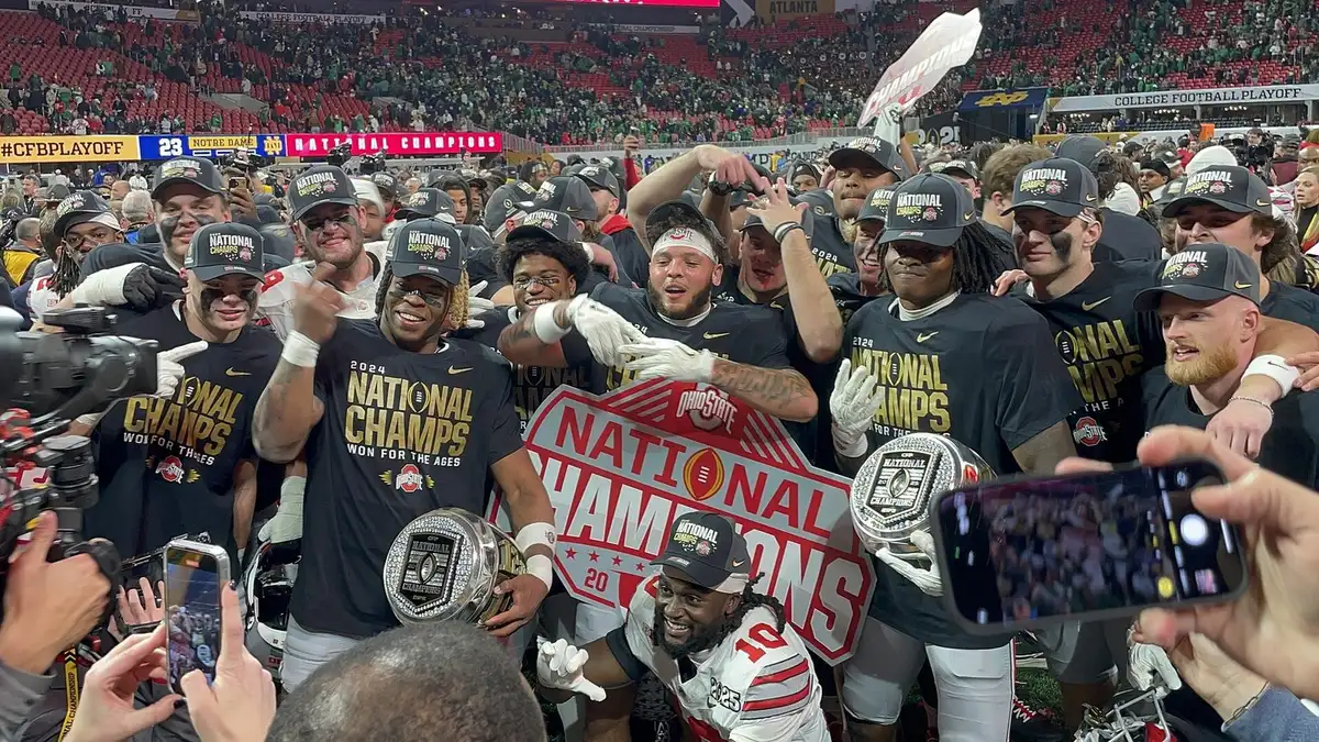 Ohio State players gathered on the field celebrating the CFP national championship